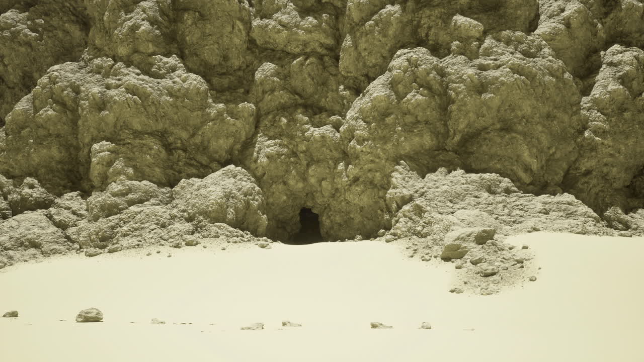 Unique natural cave entrance in rocky desert landscape under sunlight