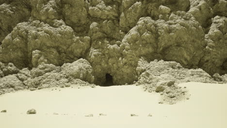 unique natural cave entrance in rocky desert landscape under sunlight