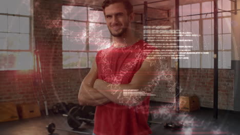 procesamiento de datos médicos contra el retrato de un hombre en forma caucásico sonriendo mientras está de pie en el gimnasio