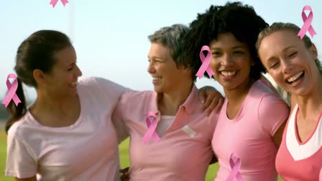 animation of pink cancer ribbons over diverse women embracing