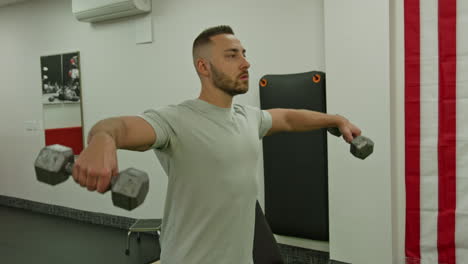 muscular man actively training in the modern gym