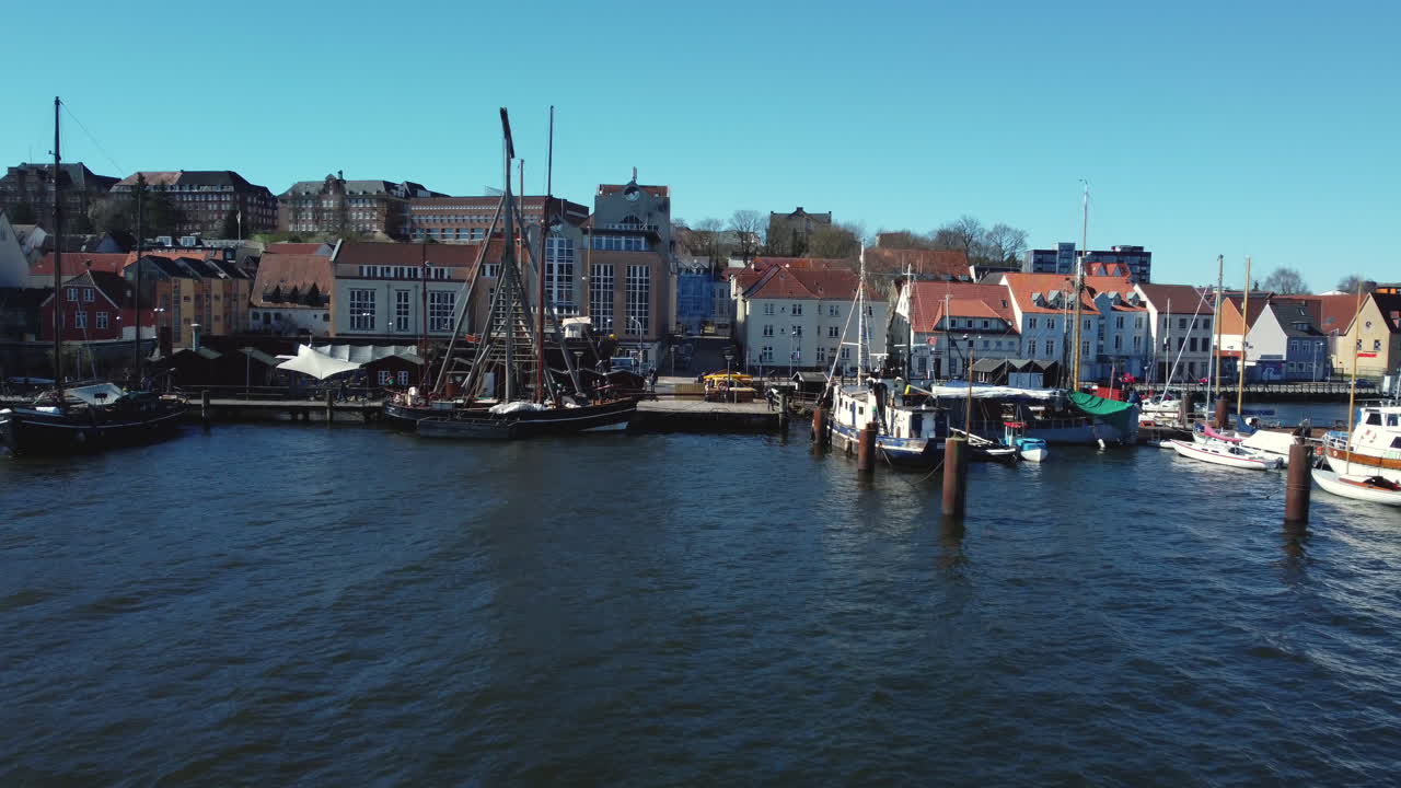 Aerial view of a European harbour with old boats and buildings