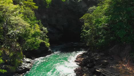 aerial footage of a cove from a cliff in the caribbean