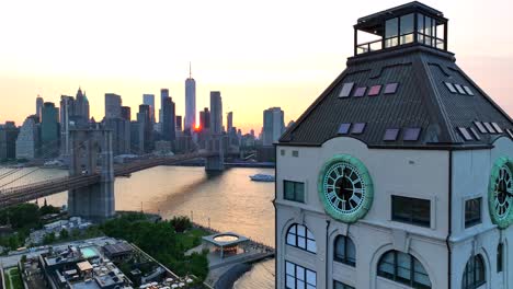 Aerial-view-of-Clock-Tower-Condominium-in-Brooklyn-Heights-and-Brooklyn-bridge-Wirth-epic-Skyline-in-Background-at-golden-sunset---Panning-wide-shot