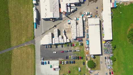 aerial view of distribution center, drone photo of industrial logistics zone,new super modern logistics center full of modern technology and robotics,roof solar power plant for green energy production