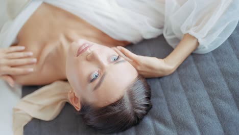 woman relaxing in a white dress