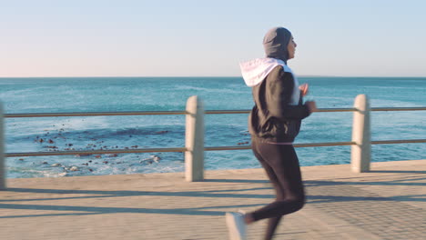 muslim woman, running or fitness by ocean