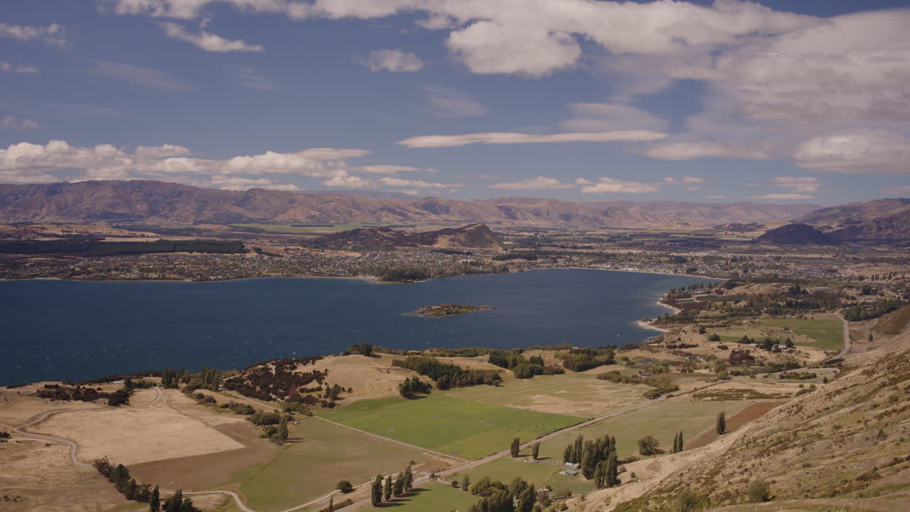 Panoramic View of a Lake and Surrounding Valley in New Zealand