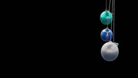 animation of christmas baubles on black background