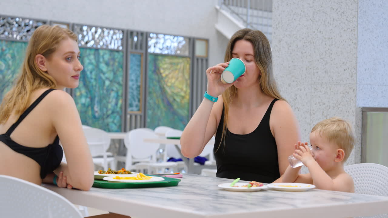 Family Eating at Poolside Cafe