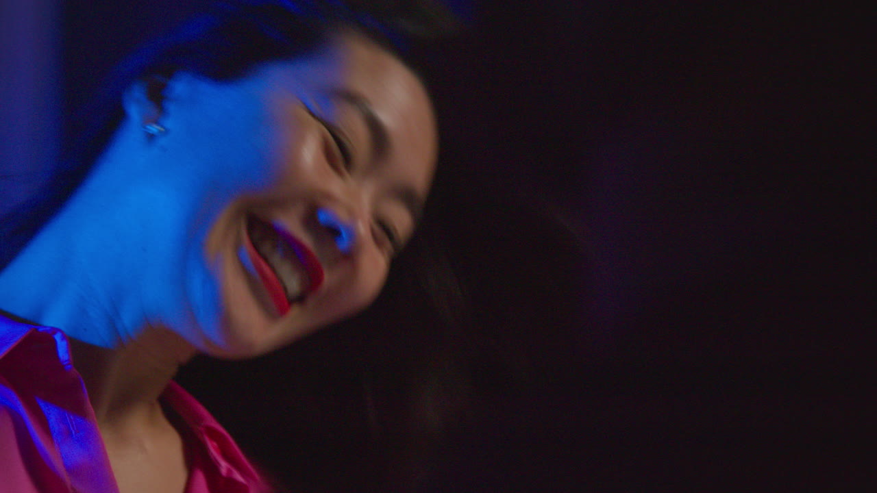 Close Up Of Young Couple Having Fun Dancing At House Party Or In Club Together