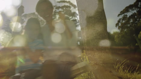 mother and daughter swinging on a swing together