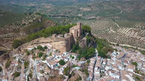 aerial view of the church in top of the big rock over montefrio in granada, andalusia