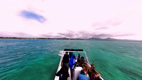 experience a serene boat ride through the crystal clear waters of mauritius, surrounded by tropical landscapes and stunning marine life.