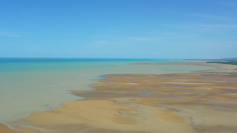 Low-Tide-Sand-Bank-Meets-Blue-Ocean-On-Australian-North-Queensland-Beach-Shore,-Aerial-Drone-4K