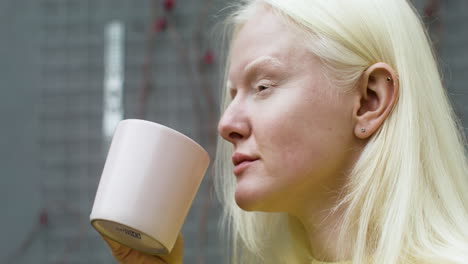 closeup of woman drinking coffee