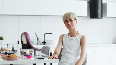 queer man posing indoors