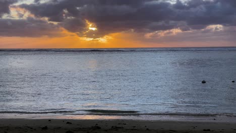 a serene beach panorama of île aux cerfs in mauritius, where crystal-clear waters meet peaceful sandy shores