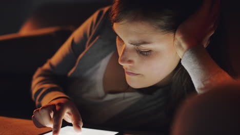 happy young woman using tablet computer online shopping at home