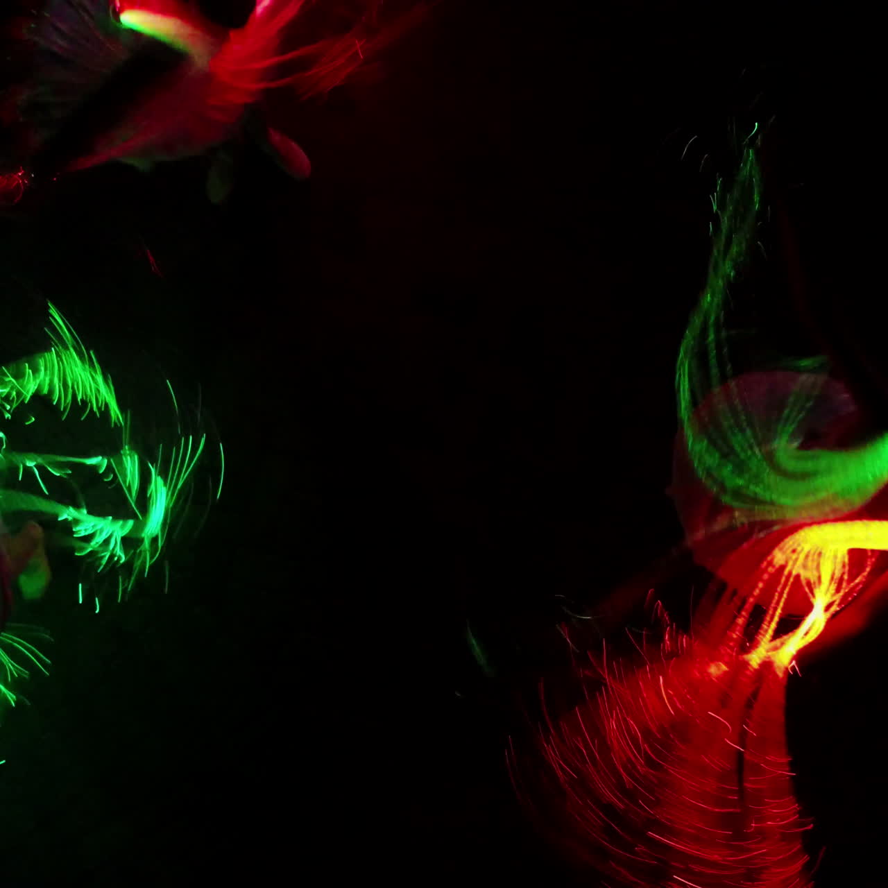 Dancing girls in LED costume at night outdoor. LED show. Square video