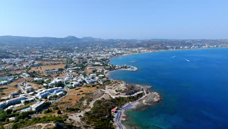 aerial tracking shot in front of the faliraki village, in sunny rhodes, greece
