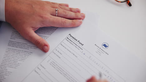signing a pension fund document