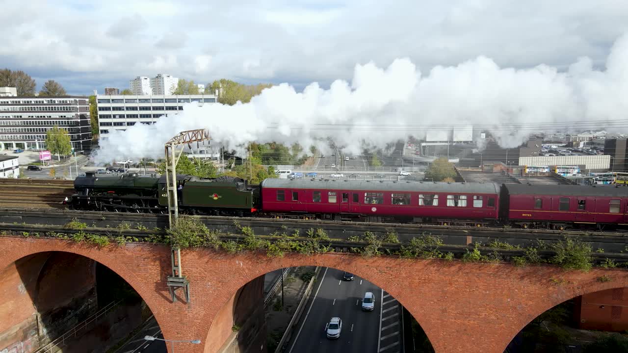 The 'Mancunian' Steam train carriage from London Euston to Manchester Piccadilly being pulled by steam locomotive 45596 &lsquo;Bahamas&rsquo; over Stockport Viaduct