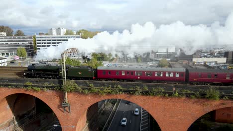 The &#039;Mancunian&#039; Steam train carriage from London Euston to Manchester Piccadilly being pulled by steam locomotive 45596 &lsquo;Bahamas&rsquo; over Stockport Viaduct