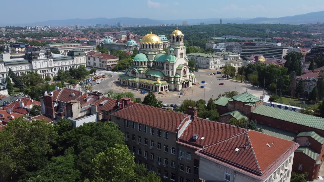 4K drone view of Orthodox Alexander Nevsky Cathedral in Sofia with city of Sofia in background - Bulgaria