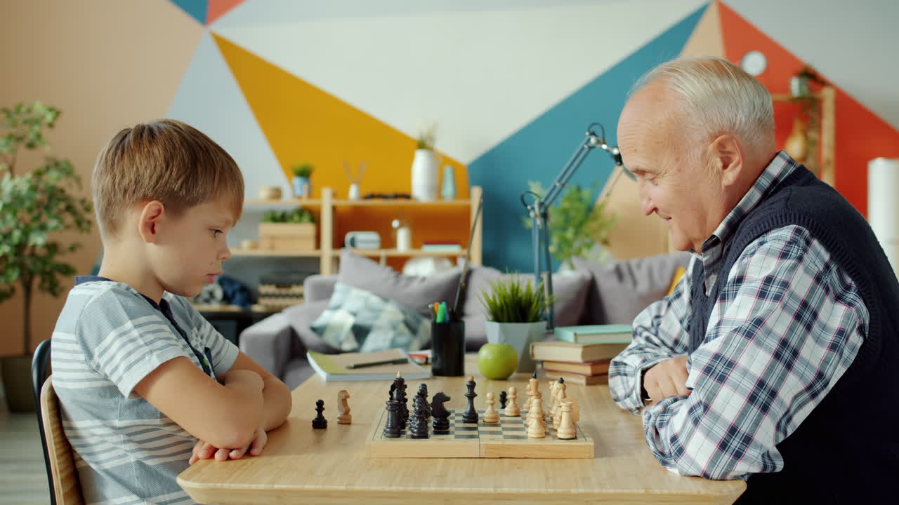 Grandfather and Grandson Playing Chess