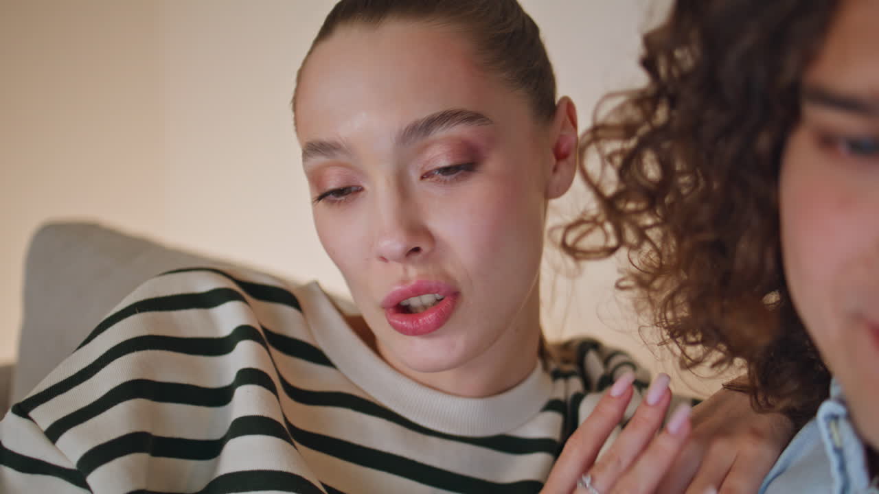 Wife husband talking online meeting at evening apartment closeup. Woman speaking