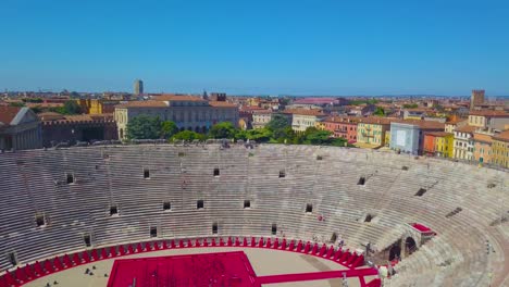 aerial view of arena di verona, italy. the video was filmed over the arena and the city is visible in the distance. a view of the arena and the city opens.