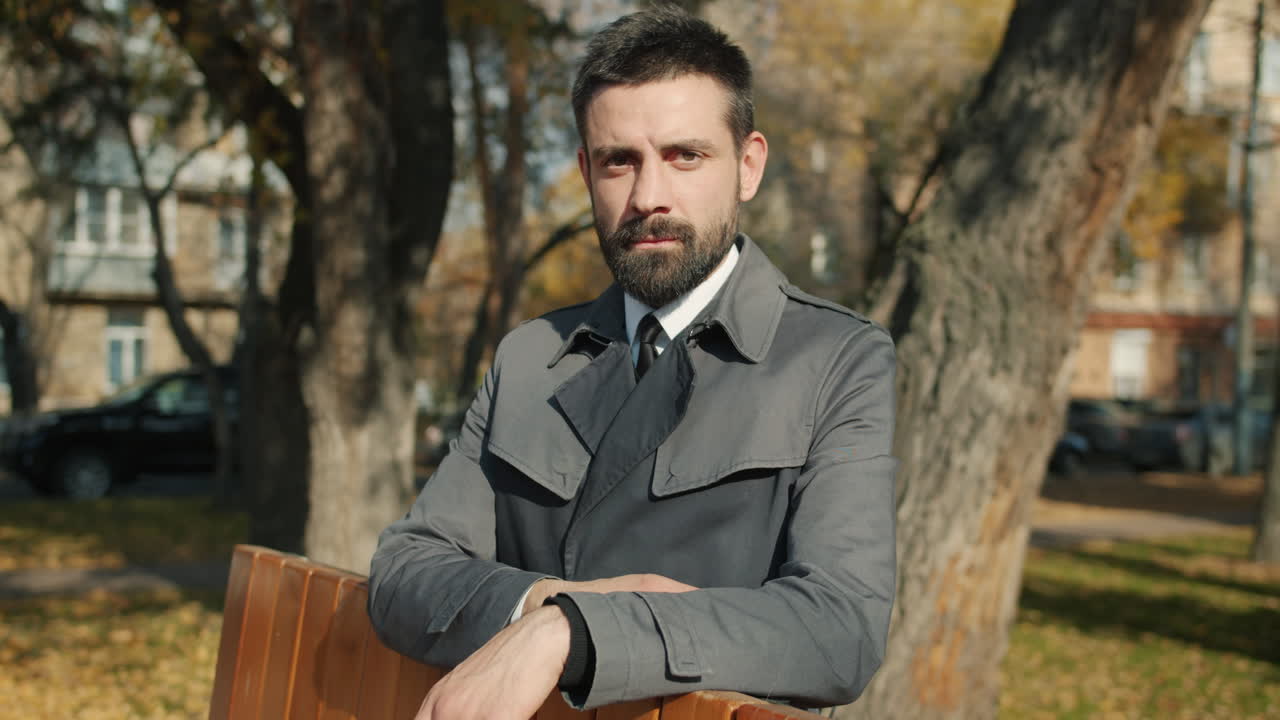 Businessman in a park in autumn