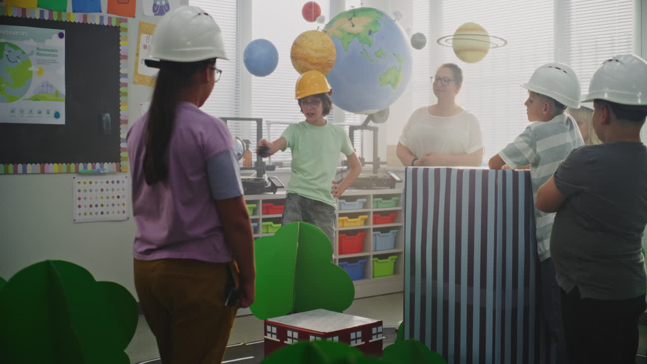 Team of Primary School Students in Hardhats Creating City Planning