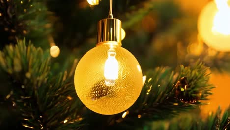 close-up of a christmas tree ornament with lights