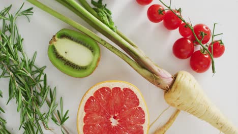 Video-of-fresh-fruit-and-vegetables-on-white-background