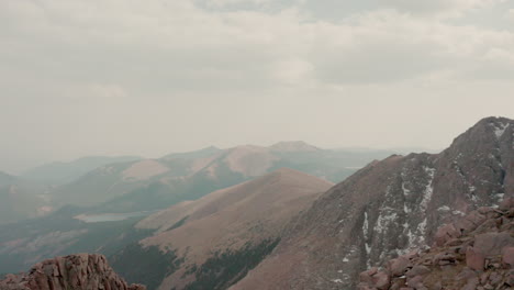 thick wildfire smoke covers peaks of colorado mountain range