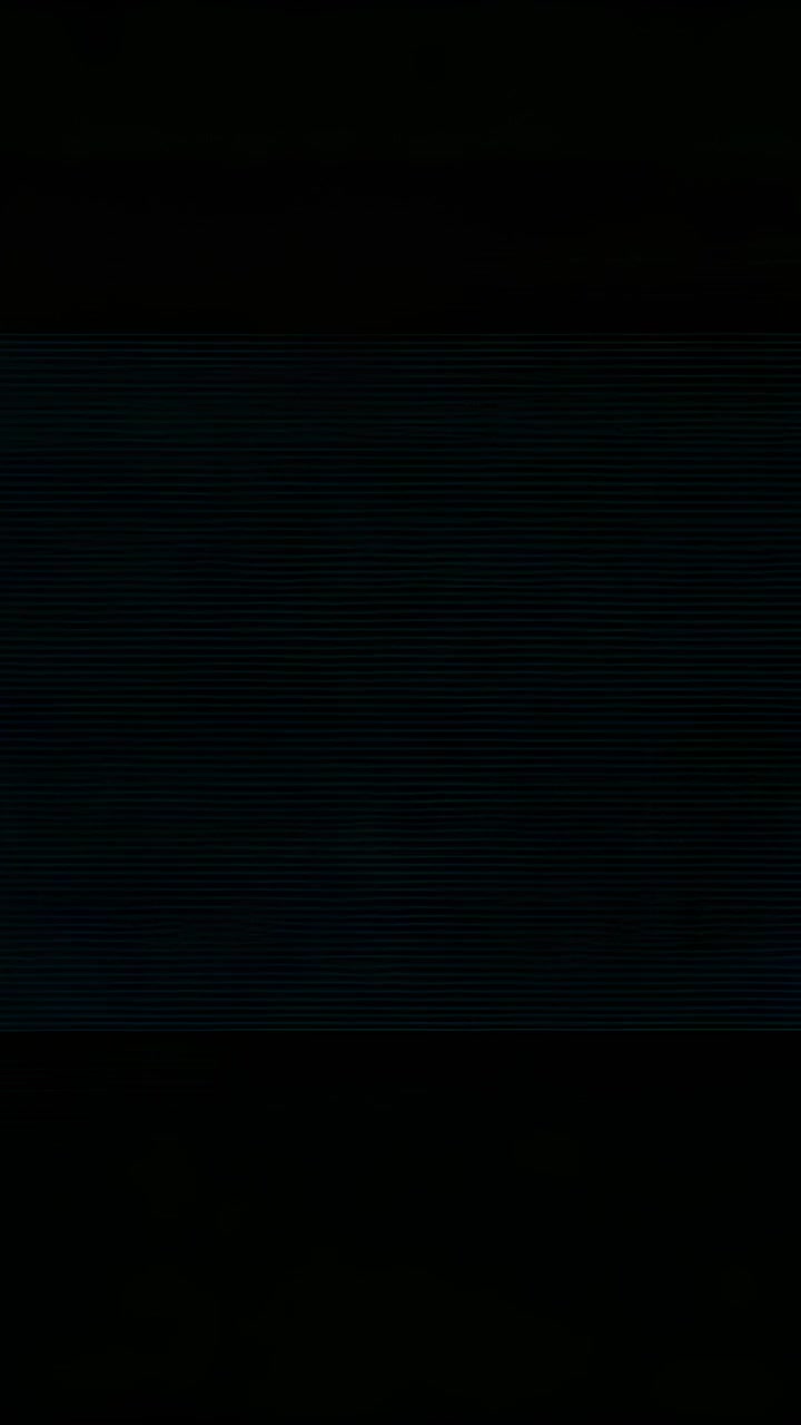 Vertical video: Initiating playback showing blank dark screen remaining steady on unlit screen