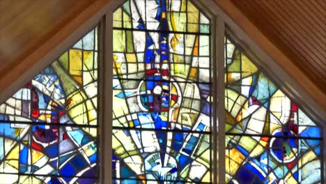 shot-of-the-beautiful-window-art-in-a-religious-Christian-or-catholic-chapel