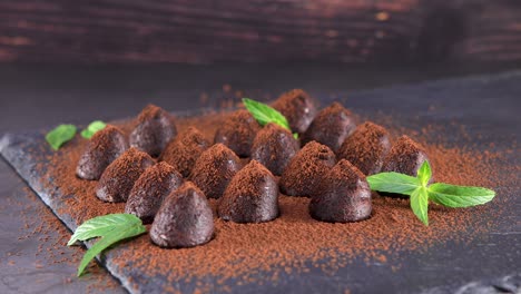 homemade chocolate truffles with mint sprinkled with cocoa powder