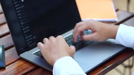 hands of a businessman working on a laptop in the office. closing