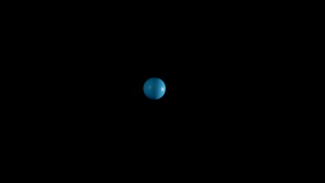 blue balls bouncing against a black background