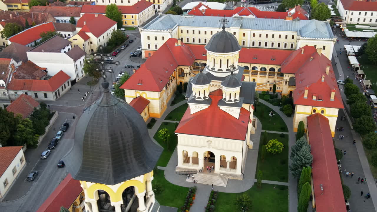 Aerial drone view of Alba Carolina Citadel in Alba-Iulia, Romania. Cityscape, multiple buildings, church, people