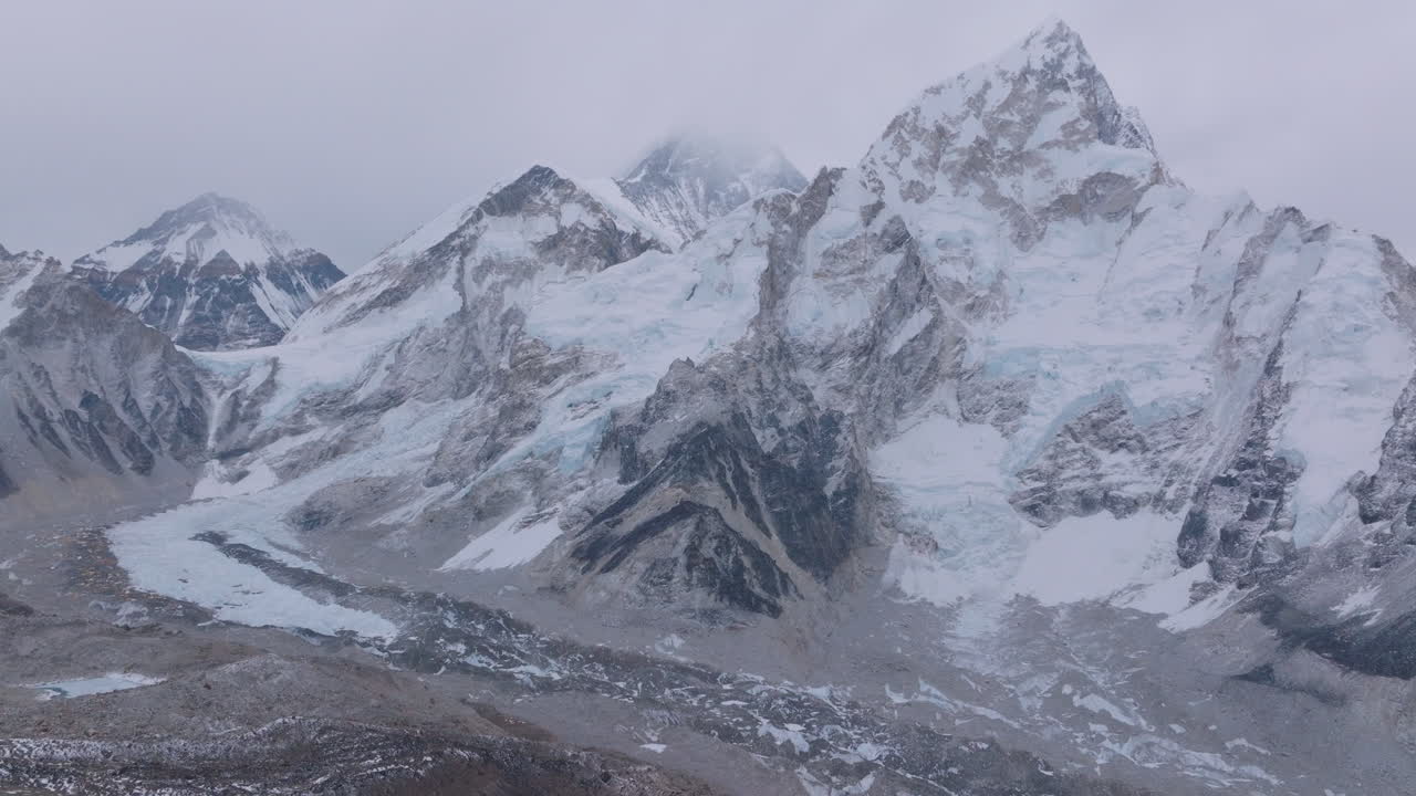 View of Mount Everest from Kala Patthar, Nepal. The world’s highest peak with cloudy skies, less snowfall, and dense Himalayan winter landscape reflects changing weather, climate crisis, adaptation