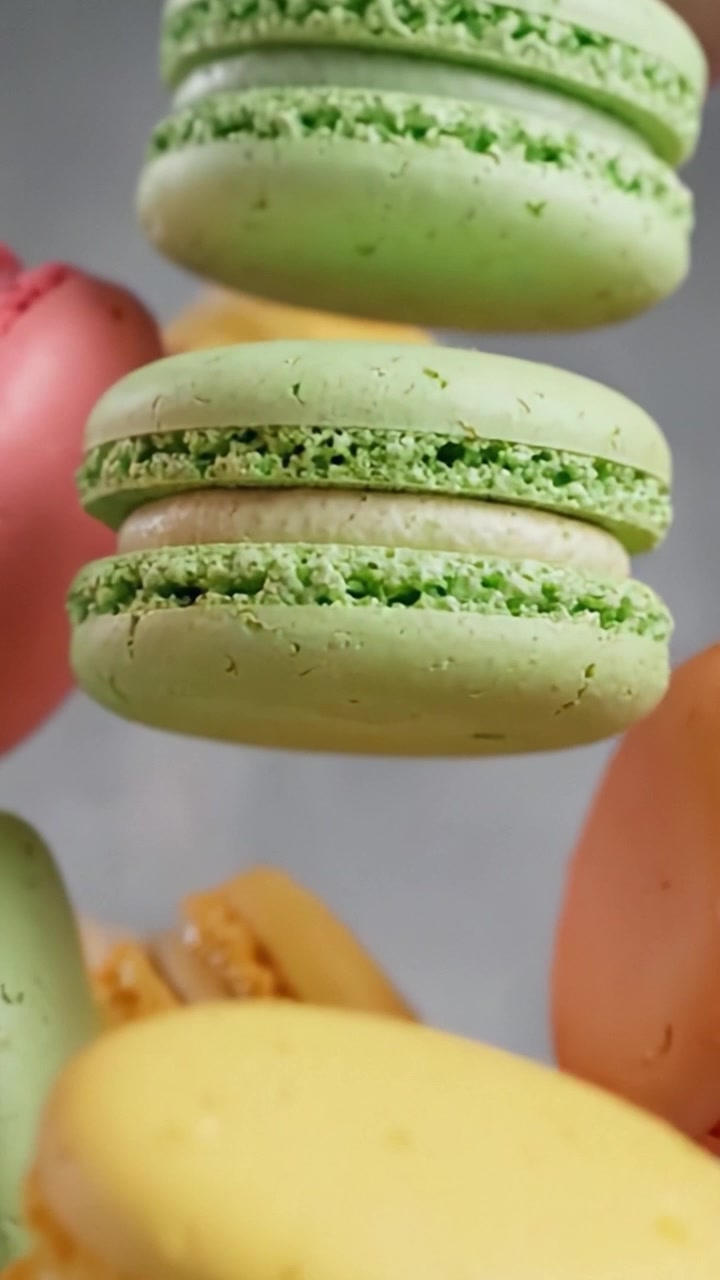 Deliciously Colorful Macarons: A Visual Symphony of Flavorful French Pastries Captured in Two Stunning Frames That Showcase Their Unique Textures and Colors