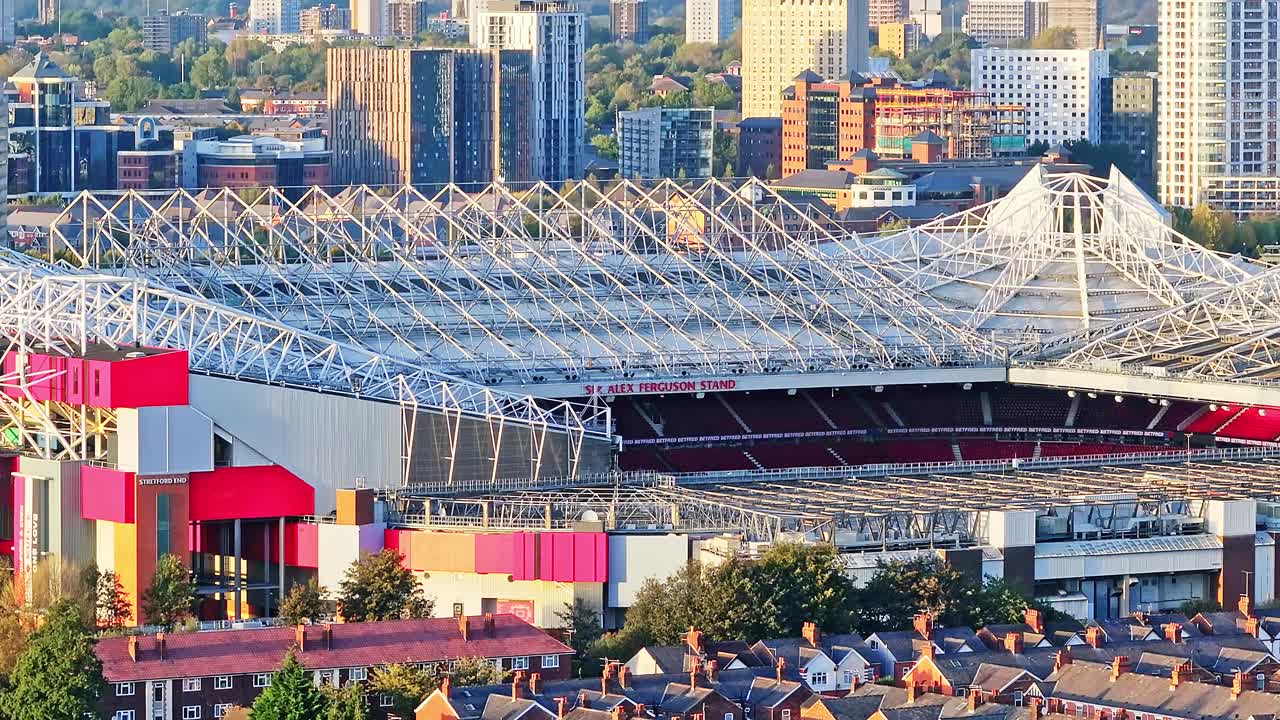 Aerial shoot rising over Manchester's Old Trafford UK, close-up Home of the Reds