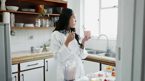 Fruit,-smoothie-and-breakfast-of-woman-in-kitchen