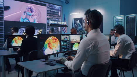 mission control team monitoring spacecraft