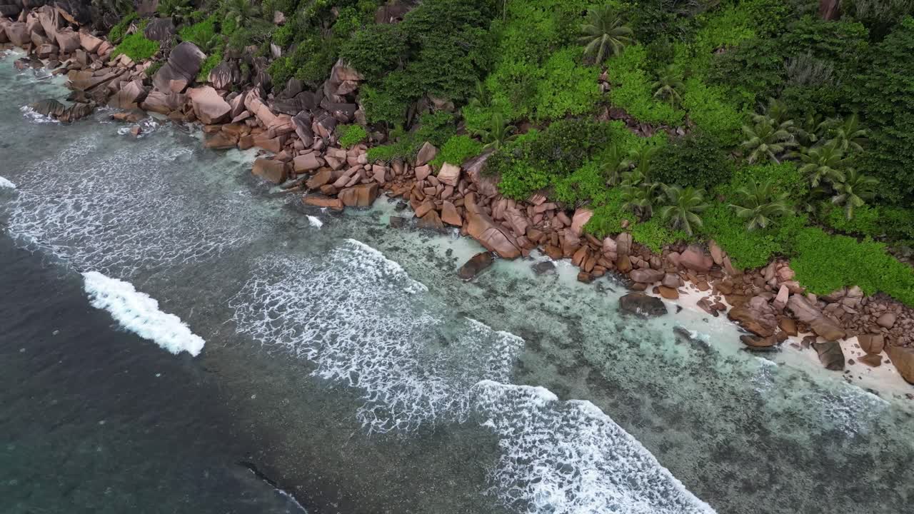 Aerial View of a Tropical Beach with Turquoise Water and Rocks
