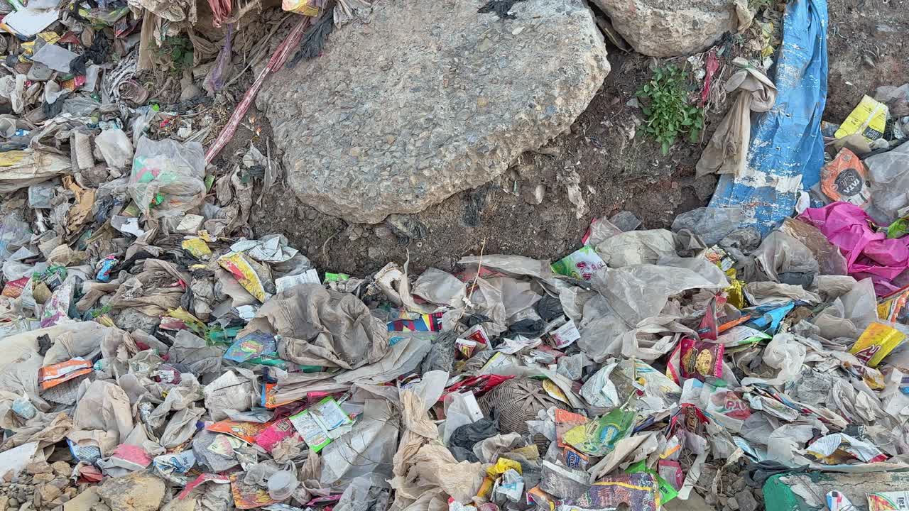 closeup shot of land filled with plastic waste